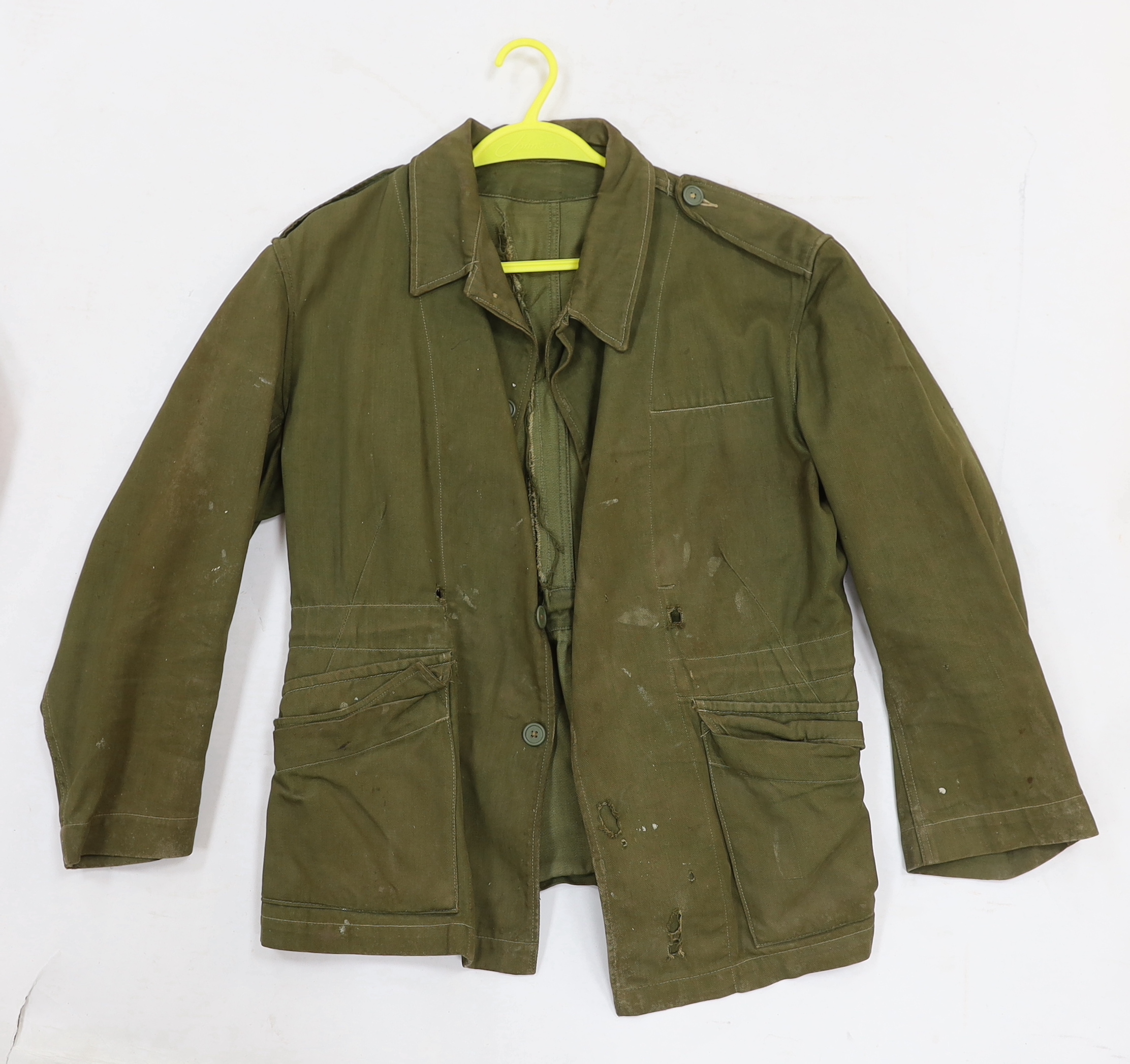 Eight British military uniform blouses/jackets, including two with Royal Sussex Regiment Cinque Ports shoulder insignia, a Queen’s A.C.F. example, etc.